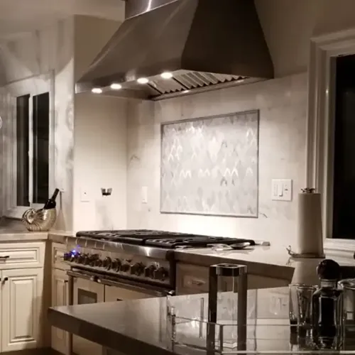 Beautiful kitchen backsplash and hood.