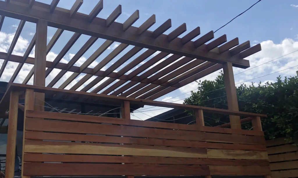 new pergola and matching wooden wall