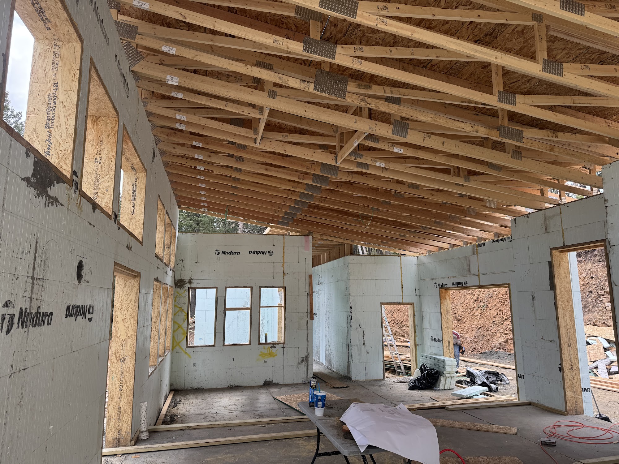 Close-up of stacked Nudura ICF blocks forming exterior walls on a Vertical Contracting Colorado mountain project